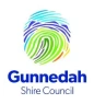 Logo of Gunnedah Shire Council featuring a colorful, stylized fingerprint design above the text "Gunnedah Shire Council." The fingerprint is composed of blue, green, and teal lines on a white background.
